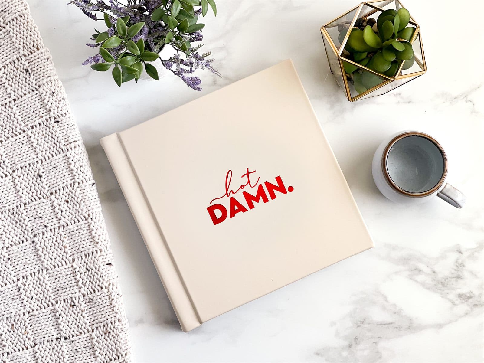 Ivory boudoir album stamped hot DAMN in red foil