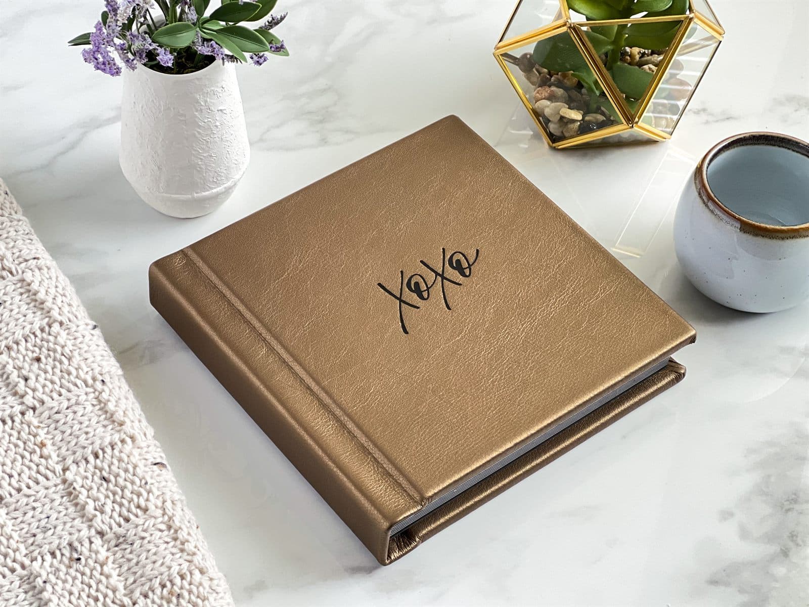 Champagne leather boudoir album stamped XOXO in black foil